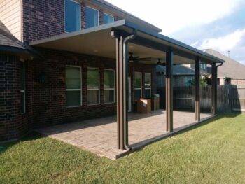 Poolside pergola made of Aluminum shading this patio located in Katy, TX.